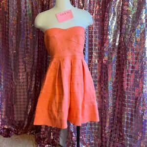 Peach colored mermaid scale dress with pleated skirt in medium